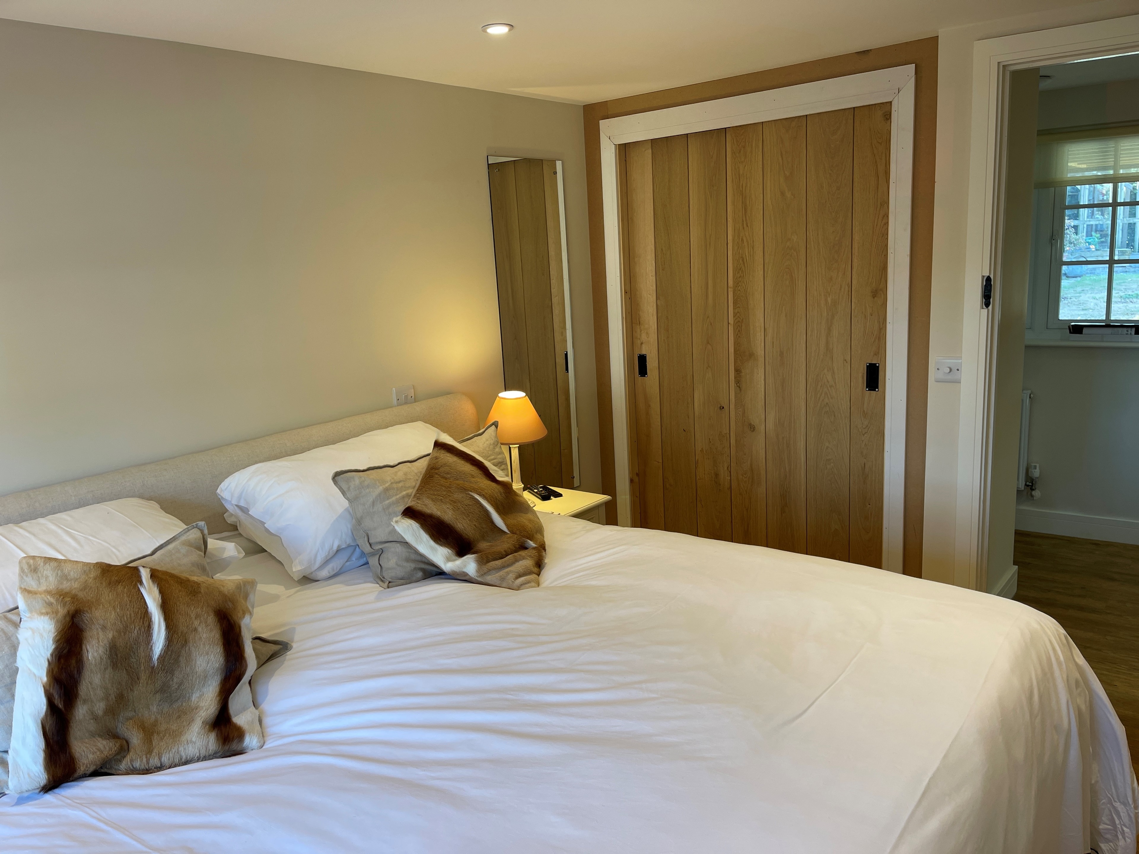 A third view of bedroom one at Neatham Barn