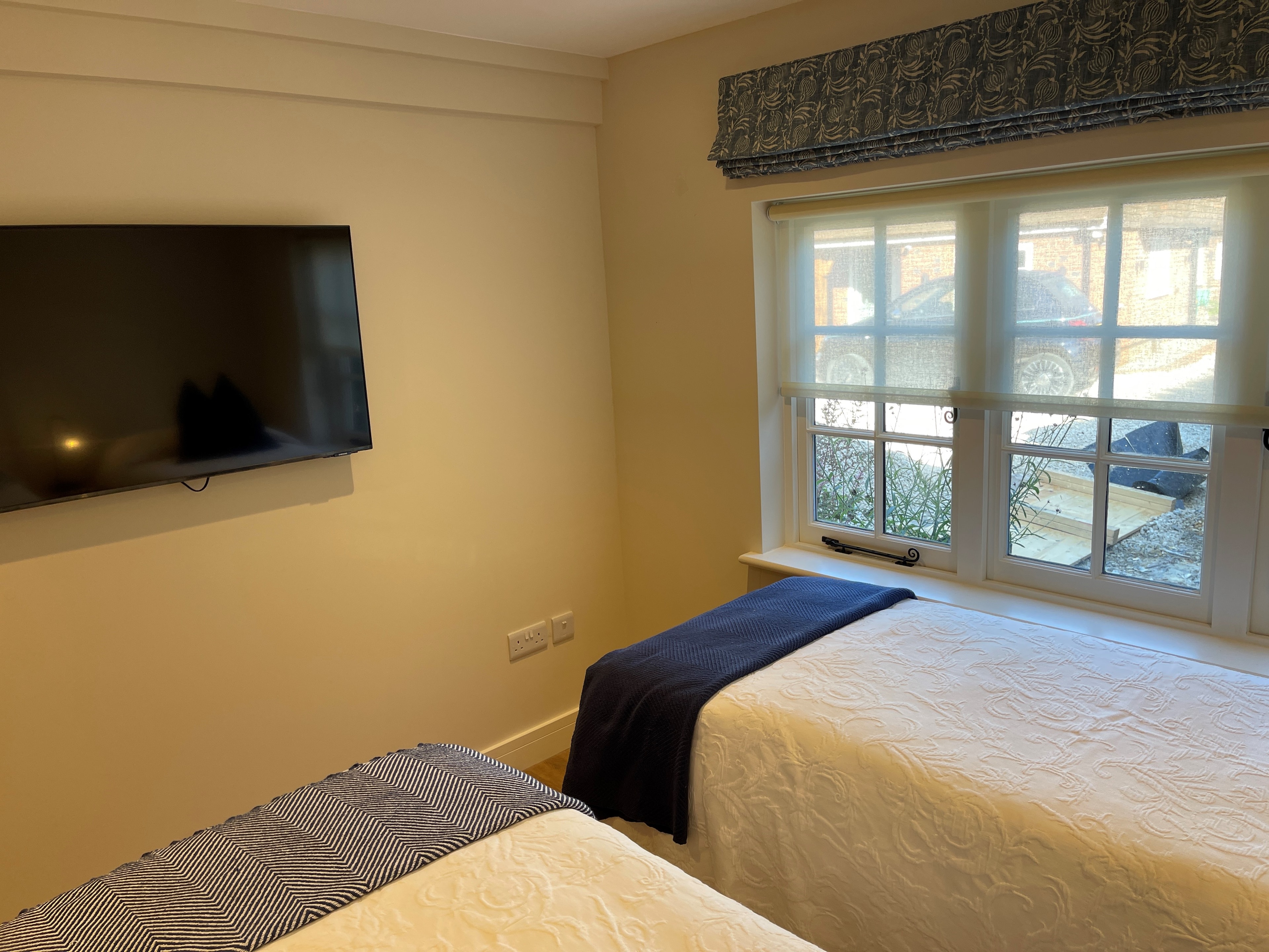 An additional view of bedroom two at Neatham Barn
