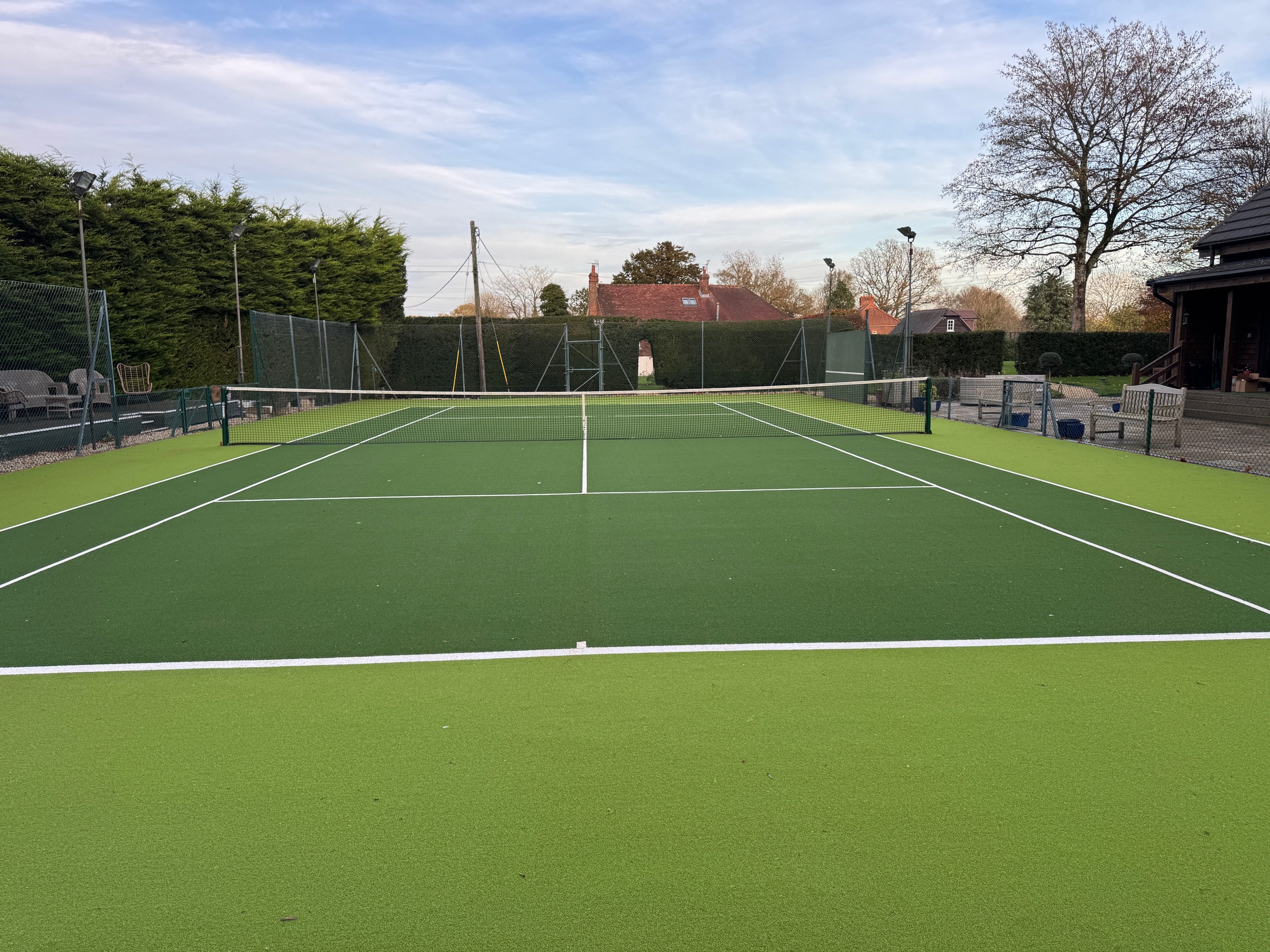 The tennis court photographed by the owners of Neatham Barn