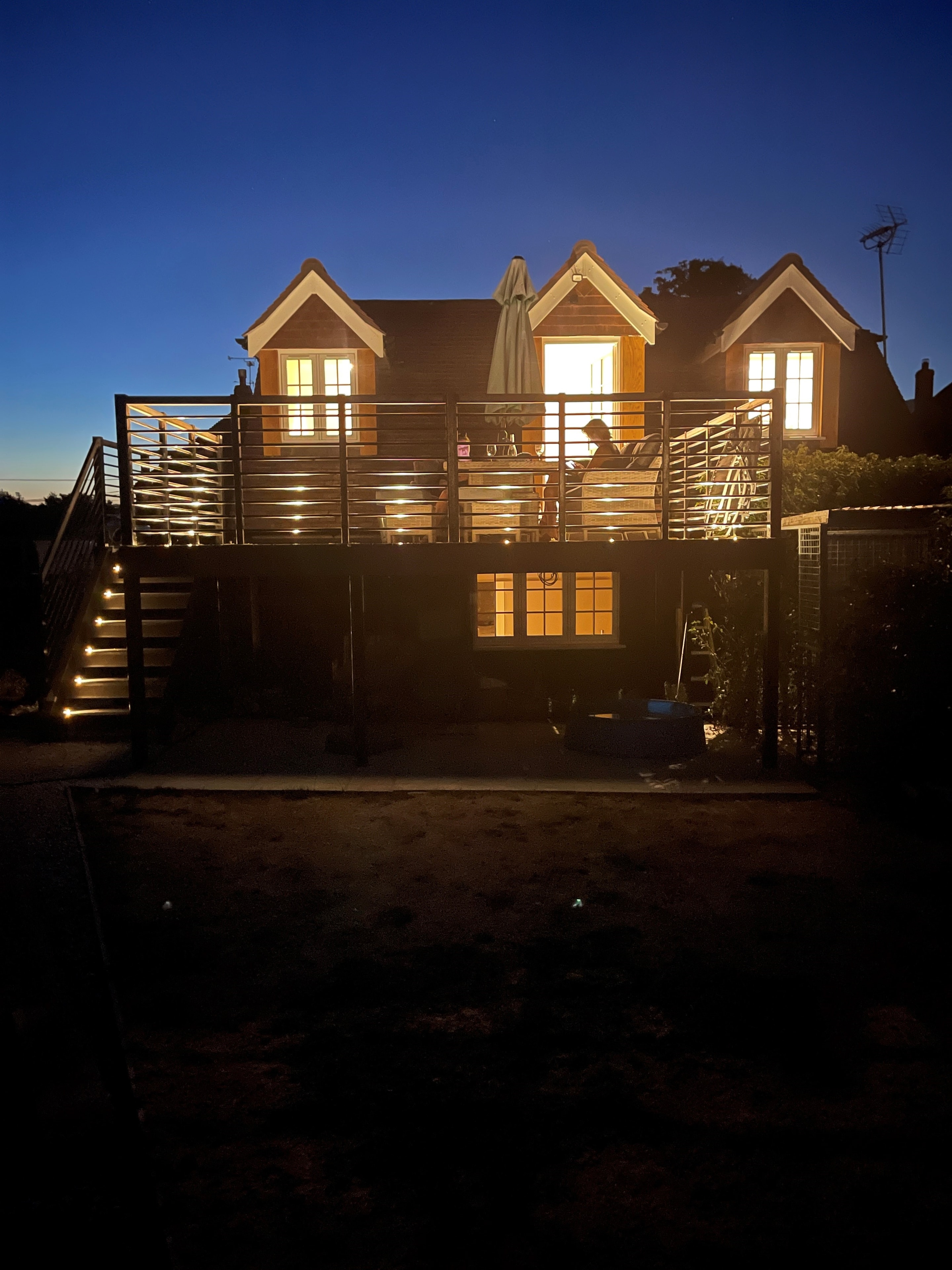 Neatham Barn illuminated in the evening